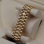 2023 ROLEX DAY-DATE YELLOW GOLD BLACK DIAL W/ BAGUETTE MARKERS 40MM 228238a
