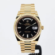 2023 ROLEX DAY-DATE YELLOW GOLD BLACK DIAL W/ BAGUETTE MARKERS 40MM 228238a