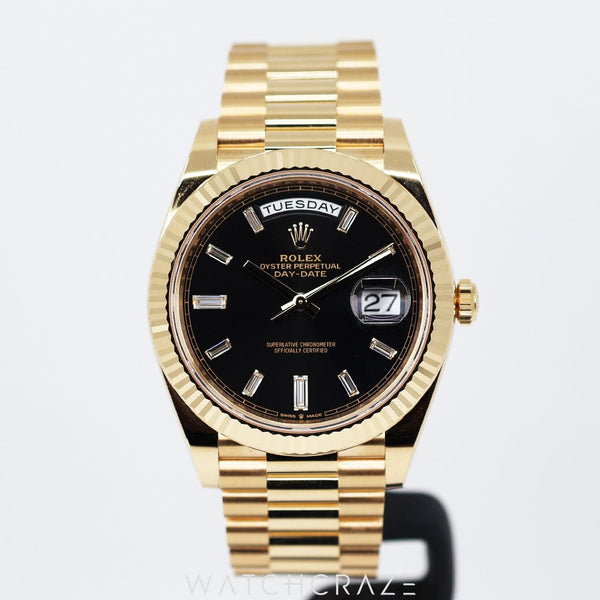 2023 ROLEX DAY-DATE YELLOW GOLD BLACK DIAL W/ BAGUETTE MARKERS 40MM 228238a