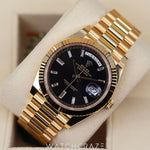 2023 ROLEX DAY-DATE YELLOW GOLD BLACK DIAL W/ BAGUETTE MARKERS 40MM 228238a