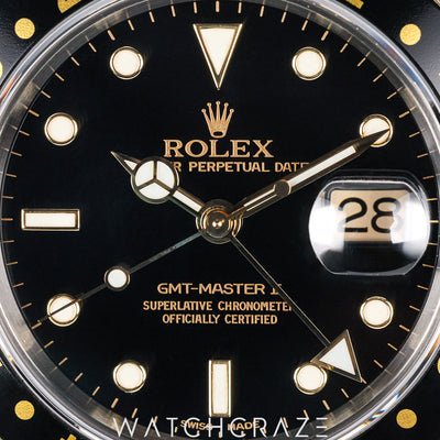 ROLEX GMT MASTER II TWO TONE YELLOW GOLD AND STEE BLACK DIAL 40MM 16713